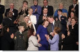 During the State of the Union Address Wednesday, Feb. 2, 2005, Janet and William Norwood, center, comfort each other as President Bush talks about their son, Marine Corps Sergeant Byron Norwood of Pflugerville, Texas, who died during the assault on Fallujah. "Ladies and gentlemen, with grateful hearts, we honor freedom's defenders, and our military families, represented here this evening by Sergeant Norwood's mom and dad, Janet and Bill Norwood," President Bush said during his speech at the U.S. Capitol. White House photo by Eric Draper.