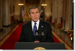 President George W. Bush addresses the nation from the Cross Hall at the White House Monday evening, March 17, 2003.  White House photo by Paul Morse